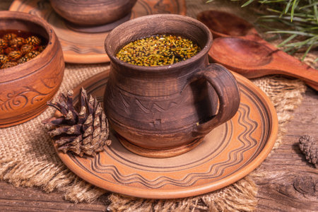 Pine needle tea, sollip-cha, traditional Korean beverage. Pine cone jam, alternative medicine, healthy life style. Vintage wooden table, close upの写真素材