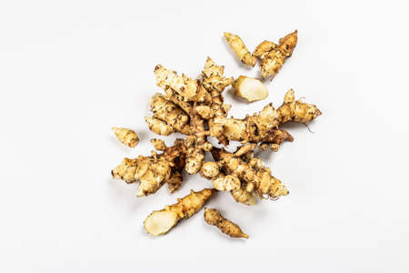 Raw Jerusalem artichoke isolated on white background. Freshly dug tubers ready to cook, flat lay, mockup, templateの写真素材