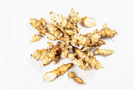 Raw Jerusalem artichoke isolated on white background. Freshly dug tubers ready to cook, flat lay, mockup, templateの写真素材
