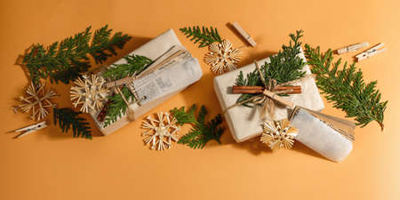 Zero waste gift concept. Christmas or New Year eco-friendly packaging. Festive boxes in craft paper...