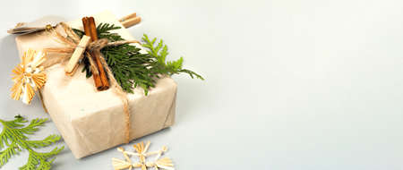 Zero waste gift concept. Christmas or New Year eco-friendly packaging. Festive boxes in craft paper...