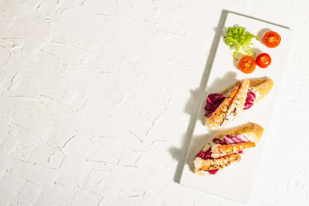 Open sandwiches with boiled shrimps, cream cheese, salad leaves and cherry tomatoes. Seafood,...