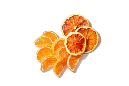 Orange marmalade isolated on white background. Jelly candies in the form of slices. Traditional sweet dessert, trendy hard light, dark shadow, flat layの写真素材