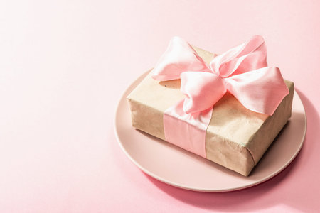 Romantic dinner table isolated on rose background. Love concept for Valentine's or Mother's day,...