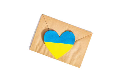 Envelope and heart in the colors of the Ukrainian flag. Stop the war concept isolated on white background. Flat lay, a place for text, mockup, template, top viewの写真素材