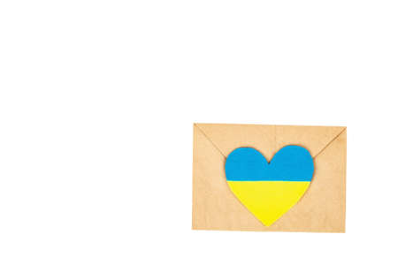 Envelope and heart in the colors of the Ukrainian flag. Stop the war concept isolated on white background. Flat lay, a place for text, mockup, template, top viewの写真素材