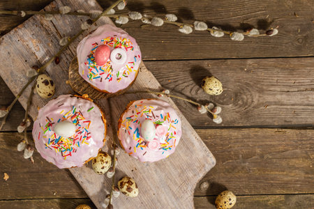 Happy Easter bread. Festive cake with traditional decor. Eggs, willow, trendy hard light, dark...