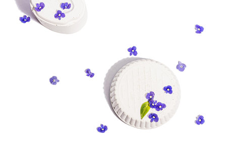 Trendy stands with blue forget me not flowers isolated on a white background. Springtime concept,...