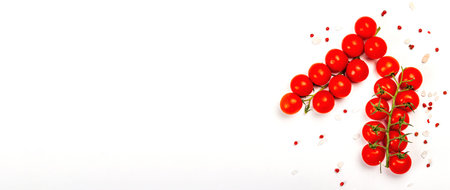 Cooking background with tomato cherry, sea salt, and rose peppercorn isolated on white background. A...