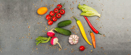 Cooking ingredients background. Spices, vegetables, garlic, colored chili peppers, and cucumbers....