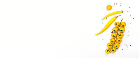 Yellow tomatoes cherry and chili pepper isolated on white background. Traditional ingredient for cooking healthy food, mockup, template, banner formatの写真素材