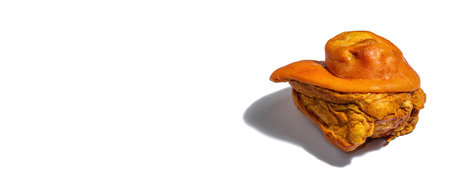 Traditional Oktoberfest smoked pork knuckle eisbein isolated on white. German festival food concept. Trendy hard light, dark shadow, mockup, template, banner formatの写真素材