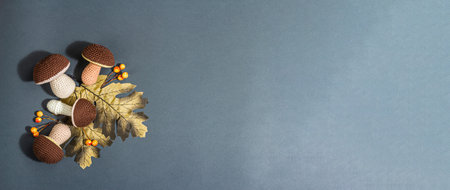 traditional autumn background. Assorted of knitted mushrooms, handmade concept. Trendy hard light,...