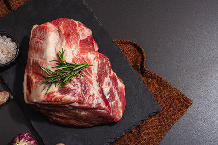 Raw pork loin with spices and herbs. Fresh meat cut, ingredient for cooking protein food, healthy...