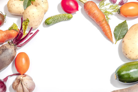 Harvest of autumn vegetables isolated on white background. Urban farm produce, hard light, dark shadow, flat lay, top viewの写真素材
