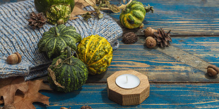 Autumn cozy composition. Crocheted sweater, pumpkins, handmade, fall hobby concept. Traditional...