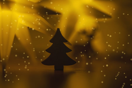 Festive greeting Christmas card. New Year holiday concept. Shiny stars, deer figure, traditional symbols. Place for text, bokeh effectの写真素材