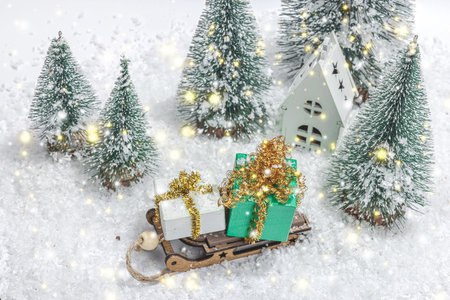 Traditional New Year composition. Festive decor, Christmas trees, festive decor, sledge, gift, snowflakes. Light background, place for textの写真素材