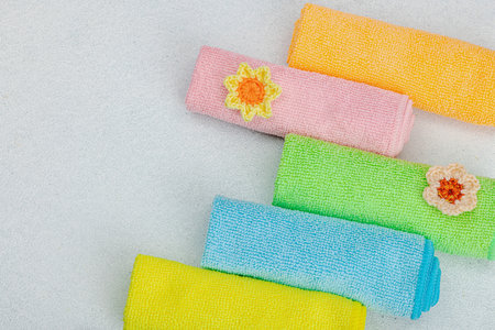 Bright colorful microfiber towels for domestic chores. Organic cleaning concept, flower freshness....