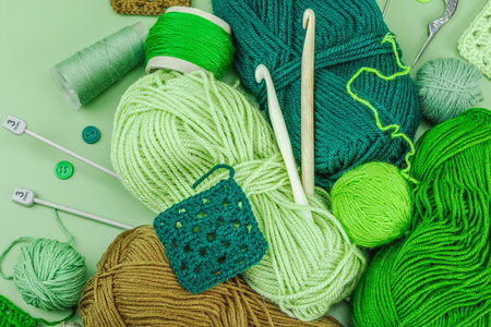 A set of knitting yarn and tools in spring colors. Handmade concept, creative art, crafting process....