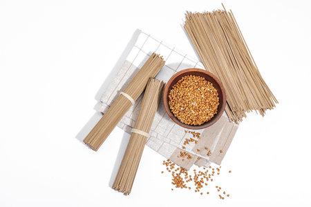 Japanese buckwheat soba noodles. Classic ingredient for preparing traditional dishes. Ceramic bowl,...