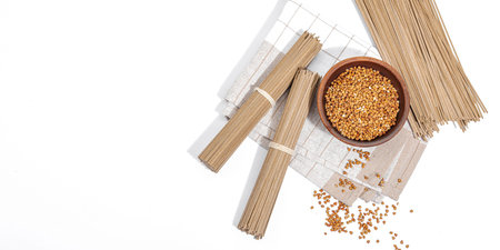Japanese buckwheat soba noodles. Classic ingredient for preparing traditional dishes. Ceramic bowl,...
