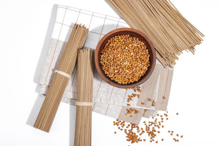 Japanese buckwheat soba noodles. Classic ingredient for preparing traditional dishes. Ceramic bowl,...