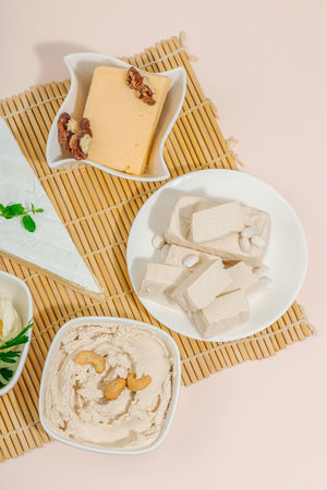 Set of assorted homemade vegan nuts cheese. Raw healthy sauce in a bowl, lactose free food. Bio...