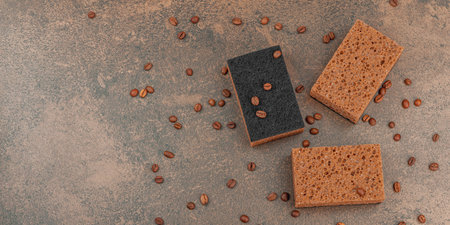 Set of sponges for washing dishes. Organic cleaning concept, coffee aroma. Zero waste style, warm...