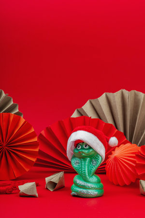 Happy Chinese New Year traditional concept, Zodiac snake symbol. Oriental asian style on red background, minimal concept, flat lay, copy spaceの写真素材
