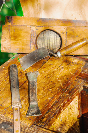 Traditional beekeeping tools, highlighting sustainable beekeeping and efforts to protect bee populations from climate change and global warmingの写真素材