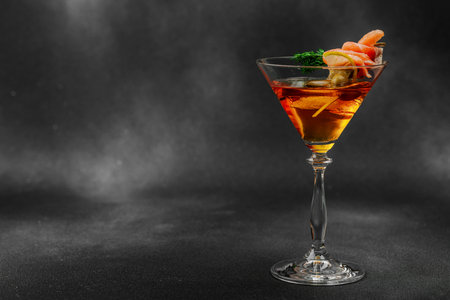 Stylish salmon martini cocktail served with smoked salmon, olive, lemon, and dill. High-end mixology trend. Perfect for bar menus, lifestyle or gourmet drink features, copy spaceの写真素材
