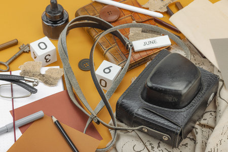Flat lay composition with vintage journalism tools, symbolizing press freedom, OSINT and Journalist's Day in Ukraine. Retro elements, analog camera on ocher background, close upの写真素材