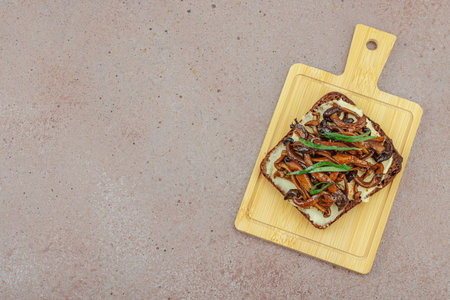 Healthy plant-based open sandwiches with sautÃ©ed Shimeji mushrooms. Protein rich vegan meal is...