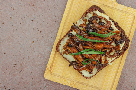 Healthy plant-based open sandwiches with sautÃ©ed Shimeji mushrooms. Protein rich vegan meal is...