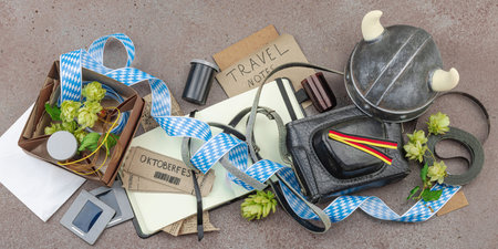 Vintage travel memories scattered across the table. Oktoberfest tickets, film slides and handwritten...