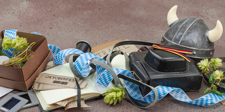 Vintage travel memories scattered across the table. Oktoberfest tickets, film slides and handwritten...