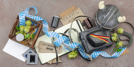 Vintage travel memories scattered across the table. Oktoberfest tickets, film slides, handwritten...