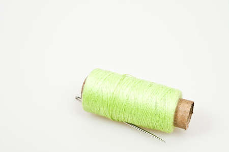 Green thread and a needleの写真素材