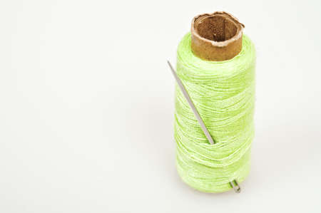 Green thread and a needleの写真素材
