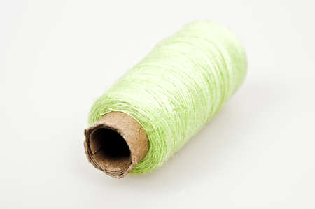 Green thread isolated on white backgroundの写真素材