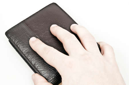 Male hand on leather walletの写真素材
