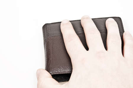 Male hand on leather walletの写真素材