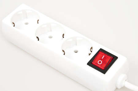 Isolated power outlet with red button の写真素材