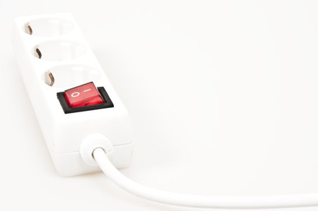 Isolated power outlet with red button 
