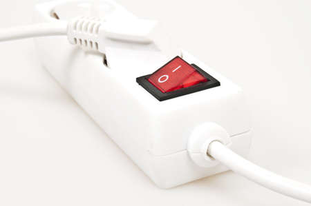 Isolated power outlet with red button の写真素材