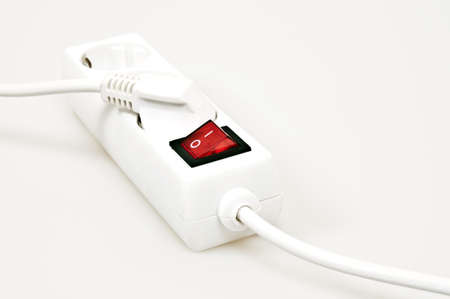 Isolated power outlet with red button の写真素材
