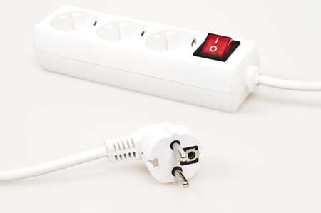 Isolated power outlet with red button の写真素材