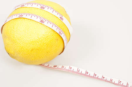 Isolated lemon and cm rulerの写真素材