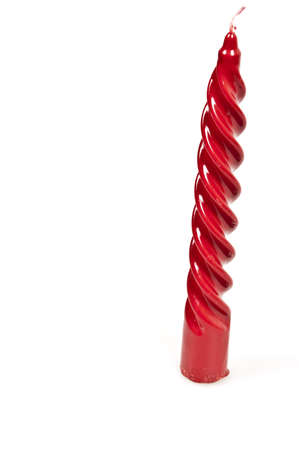 red candle isolated on white backgroundの写真素材